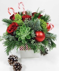 candy cande and flowers with ornaments in box