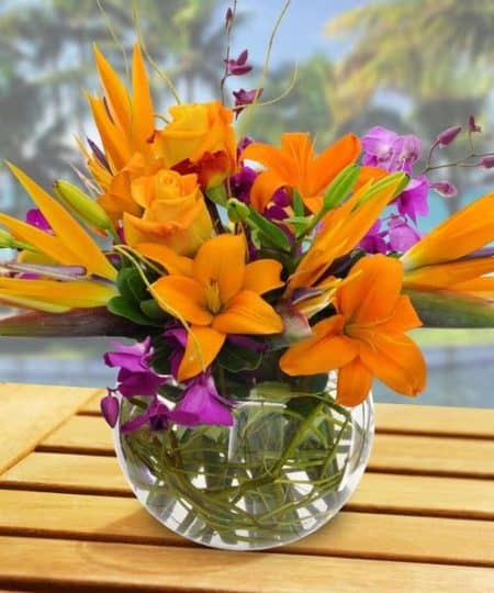  featuring vibrant Asiatic Lilies, blue and white Hydrangea, Birds of Paradise, Orchids, and Hypericum Berries.