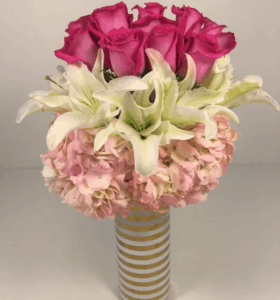 Absolutely gorgeous, Hot Pink Roses, oriental white lilies and pink hydrangea in a wonderful gold spiral vase.